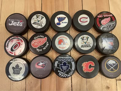 Vintage NHL Hockey Puck Collection – Lot of 15 Collectible Team Pucks (Mighty Ducks, Nordiques, Jets)